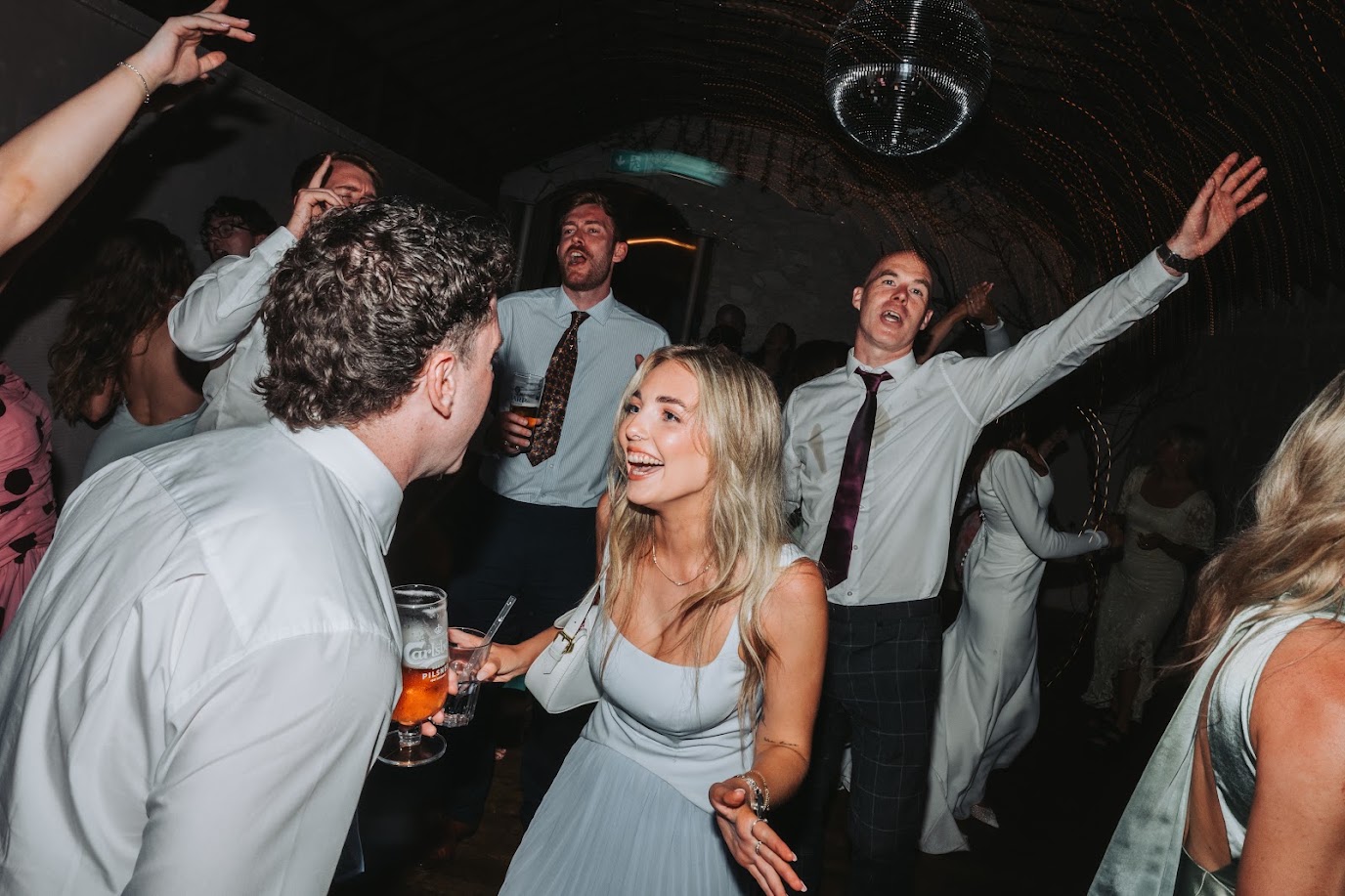 Wedding guests dancing at a Cover Notes performance